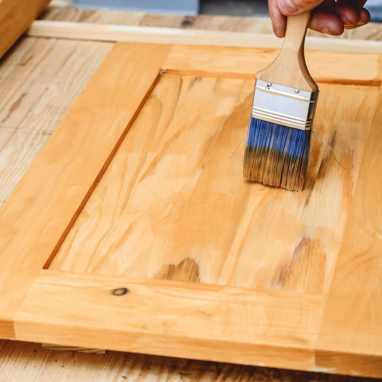 painting-wooden-surface-with-brush