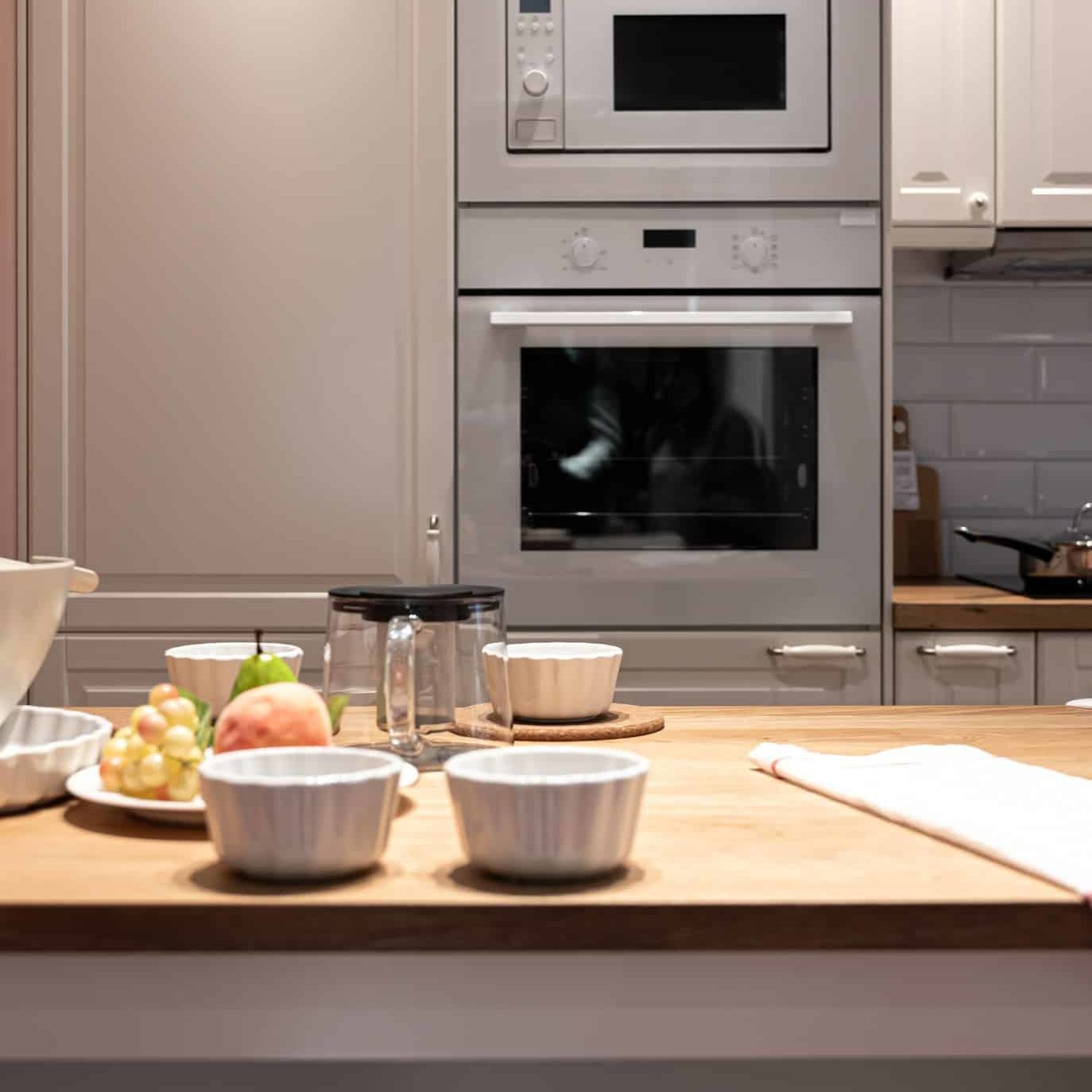 part-kitchen-interior-with-utensils-fruits-table-modern-kitchen
